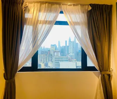 a window with a view of a city at Chambers Luxury Suites By Zaff in Kuala Lumpur