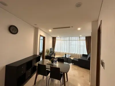 a living room with a table and a couch at Vortex suites KLCC by Nadia Guesthouse Kuala Lumpur in Kuala Lumpur