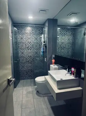 a bathroom with a sink and a toilet at Blue cozy duplex house in Kuala Lumpur