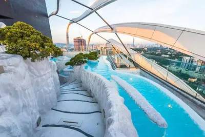 a water slide on the top of a building at Blue cozy duplex house in Kuala Lumpur