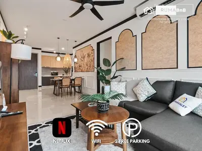 a living room with a couch and a table at IndoChina 3BR MVertica near MRT by RumaBnB in Kuala Lumpur
