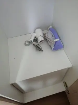 a white shelf with some items on top of it at IndoChina 3BR MVertica near MRT by RumaBnB in Kuala Lumpur