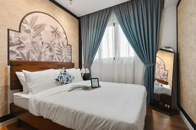 a bedroom with a large bed and a window at IndoChina 3BR MVertica near MRT by RumaBnB in Kuala Lumpur