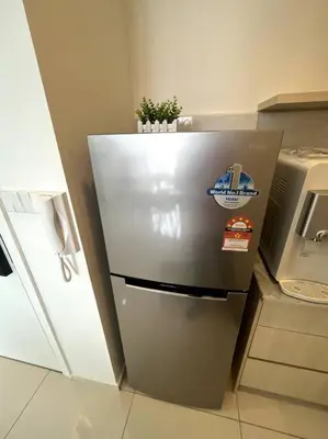 a refrigerator with a plant on top of it in a kitchen at The Robertson KLCC 1 room 1 bathroom by JZ in Kuala Lumpur