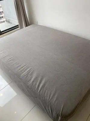 a bed sitting in a room next to a window at The Robertson KLCC 1 room 1 bathroom by JZ in Kuala Lumpur