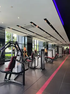 a gym with cardio equipment in a building at Star Resident KLCC By M&T in Kuala Lumpur