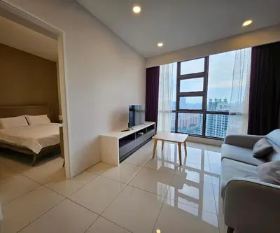 a bedroom with a bed and a couch and a window at Apartment at Robertson by Wgshomestay in Kuala Lumpur