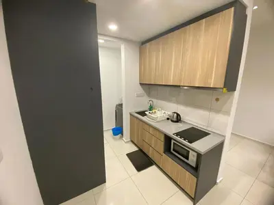 a kitchen with a sink and a counter top at Apartment at Robertson by Wgshomestay in Kuala Lumpur