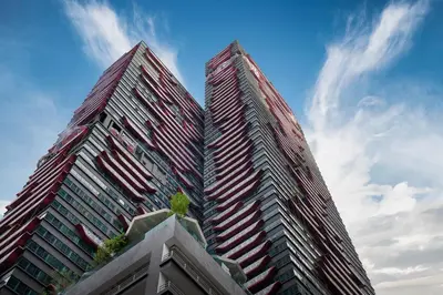 two tall skyscrapers in front of a blue sky at Arte Plus Ampang Free Parking in Kuala Lumpur