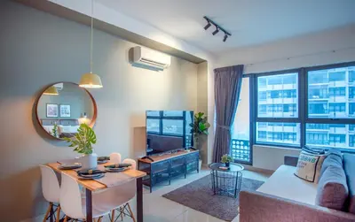 a living room with a couch and a table at Arte Plus Ampang Free Parking in Kuala Lumpur