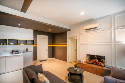 a living room with a couch and a tv at Arte Plus Ampang Free Parking in Kuala Lumpur