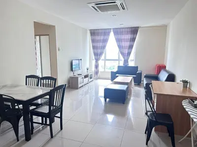 a living room with a table and chairs and a couch at Ubays Zetepark House in Kuala Lumpur