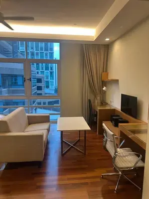 a living room with a couch and a table at Luxzell suit KlCC-7minutes walk to KLCC in Kuala Lumpur