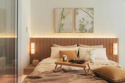 a bedroom with a bed with a table on it at NaiBnB in Quill Residences in Kuala Lumpur