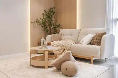 a living room with a couch and a table at NaiBnB in Quill Residences in Kuala Lumpur