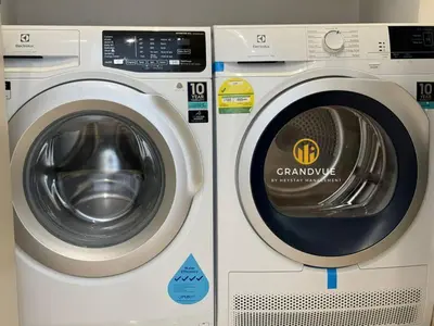 a washing machine with a washer in a store at Lucentia BukitBintang KlccView InfinityPool By HeyStay Management in Kuala Lumpur
