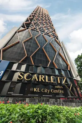 a building with a sign on the side of it at Scarletz Starlight Suites KLCC in Kuala Lumpur