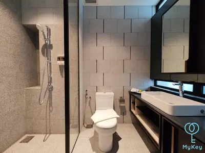 a bathroom with a shower and a toilet and a sink at Scarletz Starlight Suites KLCC in Kuala Lumpur