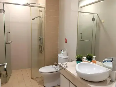 a bathroom with a toilet and a sink and a shower at Cozy Suite to NEXUS n LifeCare Med in Kuala Lumpur