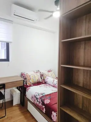 a living room with a couch in a closet at Luxury Spacious 4 Bedroom Suite - Cheras Maluri MRT in Kuala Lumpur