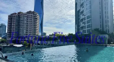 a pool of water in a city with tall buildings at SG Residence Kuala Lumpur by Fortune Suites in Kuala Lumpur
