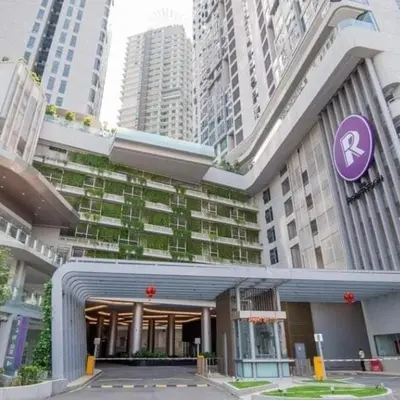 a large building with a purple sign in front of it at Robertson Bukit Bintang in Kuala Lumpur