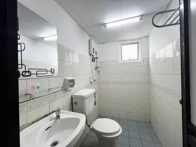 a white bathroom with a toilet and a sink at 3BR at Pantai HillPark near University Malaya Mid Valley in Kuala Lumpur