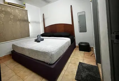 a bedroom with a bed with a teddy bear on it at 3BR at Pantai HillPark near University Malaya Mid Valley in Kuala Lumpur