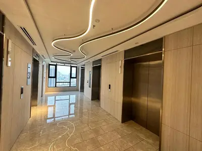 a hallway of a building with a ceiling with a hallway at Axon Residence Suites KL in Kuala Lumpur
