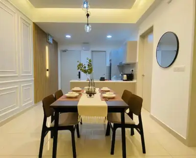 a dining room with a table and chairs at Trion KL Premium Suite in Kuala Lumpur