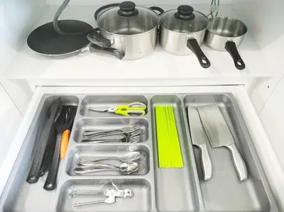 a kitchen sink with silver utensils in it at Charming Stay in the Heart of Kuala Lumpur 100Mb in Kuala Lumpur