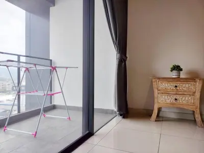 a room with a window and a table and a chair at Charming Stay in the Heart of Kuala Lumpur 100Mb in Kuala Lumpur
