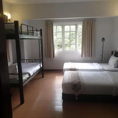 a bedroom with two bunk beds and a window at 5 Twenty @ Ampang Hilir in Kuala Lumpur