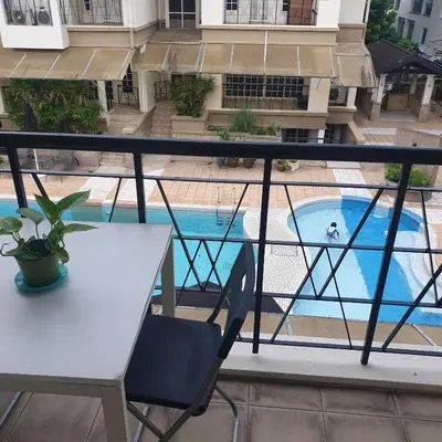 a view of a pool from the balcony of a apartment at 5 Twenty @ Ampang Hilir in Kuala Lumpur