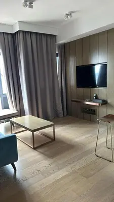 a living room with a tv and a coffee table at Star Residence KLCC By M&T in Kuala Lumpur