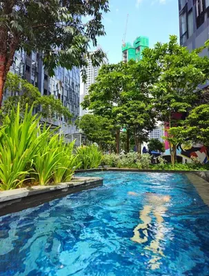 a swimming pool in a city with tall buildings at Star Residence KLCC By M&T in Kuala Lumpur