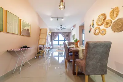 a dining room with a table and chairs at MVB36#Bali Style 3 Rooms Family Suite M Vertica Velocity Mall Cheras in Kuala Lumpur