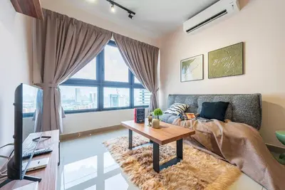 a living room with a couch and a table at MVB36#Bali Style 3 Rooms Family Suite M Vertica Velocity Mall Cheras in Kuala Lumpur