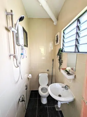 a small bathroom with a toilet and a sink at Private Room with Bathroom in Kuala Lumpur