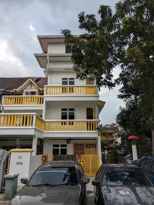 a white house with cars parked in front of it at Private Room with Bathroom in Kuala Lumpur