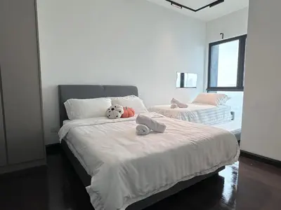 a bedroom with a bed with a stuffed animal on it at V Residence Suites-27 in Kuala Lumpur
