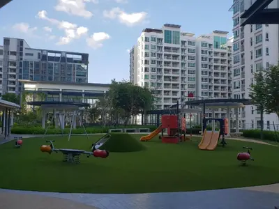 a playground in a city with a park with swings at V Residence Suites-27 in Kuala Lumpur