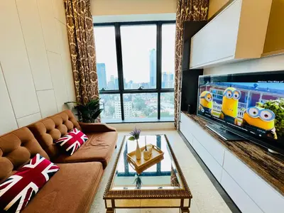 a living room with a couch and a flat screen tv at Dorsett 2BR 6Pax Pavilion Bukit Bintang TRX KLCC in Kuala Lumpur