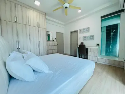 a bedroom with a white bed with a ceiling fan at Sunway Velocity V Residence by DeUrban in Kuala Lumpur
