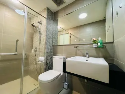 a bathroom with a toilet and a sink and a shower at Sunway Velocity V Residence by DeUrban in Kuala Lumpur