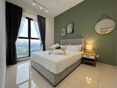 a bedroom with a large bed and a mirror at Trion Kuala Lumpur in Kuala Lumpur