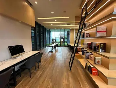 an office with a library with a desk with a computer at Star Resident KLCC By M&T in Kuala Lumpur