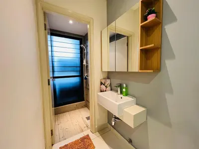 a bathroom with a sink and a mirror at Arte Mont Kiara by DeUrban in Kuala Lumpur