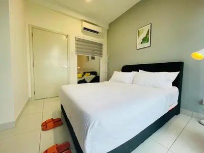 a bedroom with a large white bed in it at Arte Mont Kiara by DeUrban in Kuala Lumpur