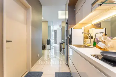 a kitchen with a sink and a counter at Dorsett Residences Sri Hartamas 5 Star Suites KL in Kuala Lumpur
